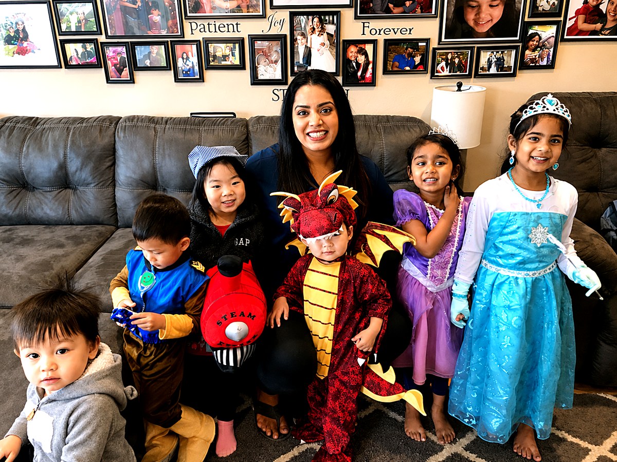 Jessica with children at a dress-up celebration