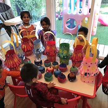 Children showing off their colorful craft lanterns