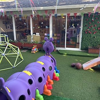 Purple caterpillar play tunnel in the backyard